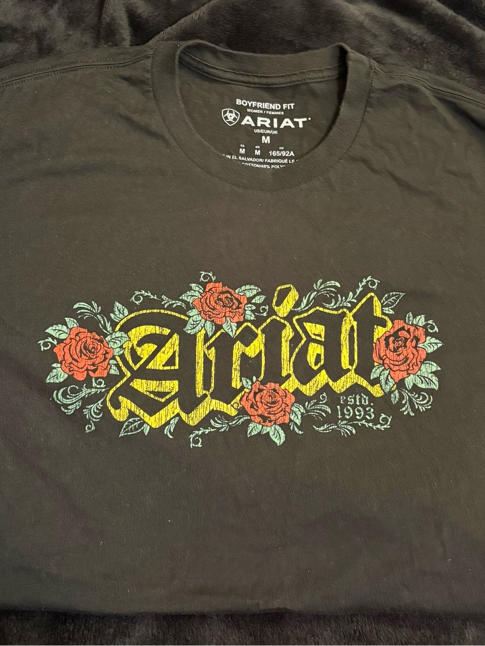 Ariat Black Short-Sleeve Tee with Yellow Logo and Red Floral Accent